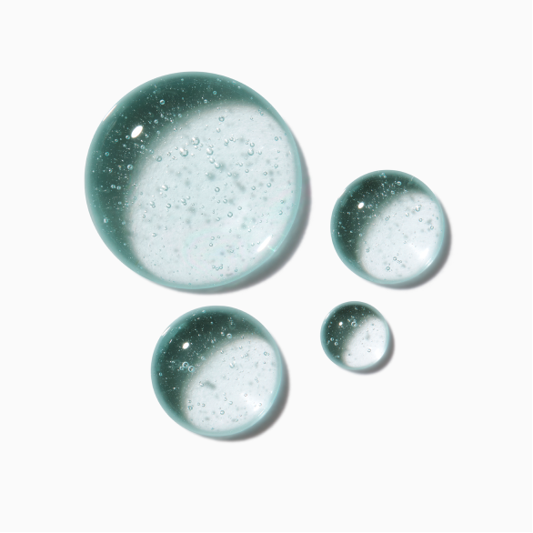 Gotas do sérum noturno da gama symbiose da kérastase em fundo branco